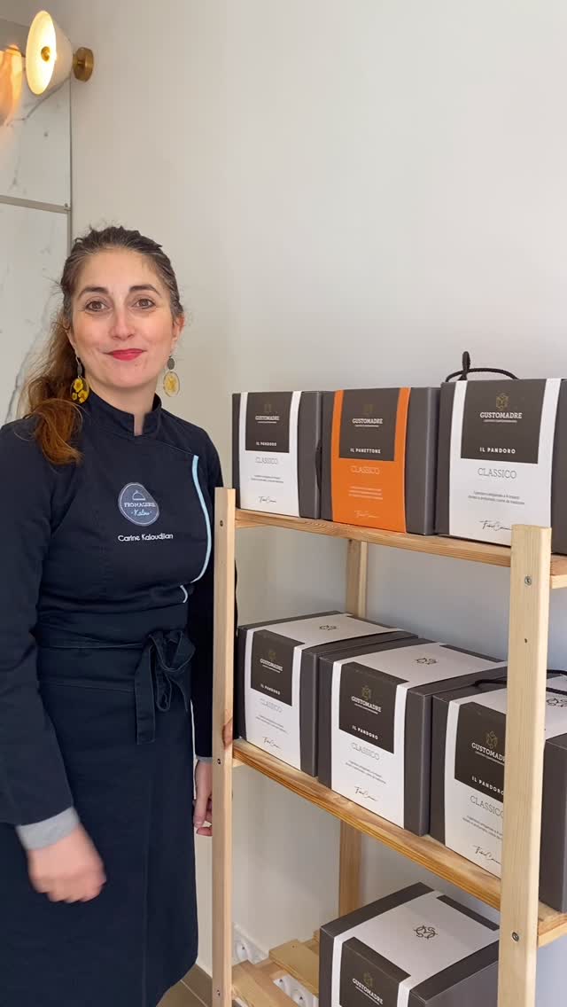 Carine Kaloudjian dans sa nouvelle boutique du Prado, Fromagerie Kalou Marseille — apron brodé, meules d'affinage en arrière-plan